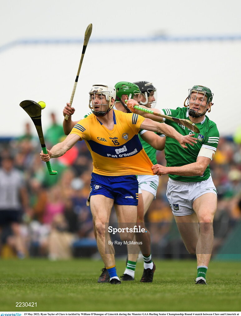 15 May 2022; Ryan Taylor of Clare is tackled by William O'Donogue of Limerick during the Munster GAA Hurling Senior Championship Round 4 match between Clare and Limerick at Cusack Park in Ennis, Clare. Photo by Ray McManus/Sportsfile