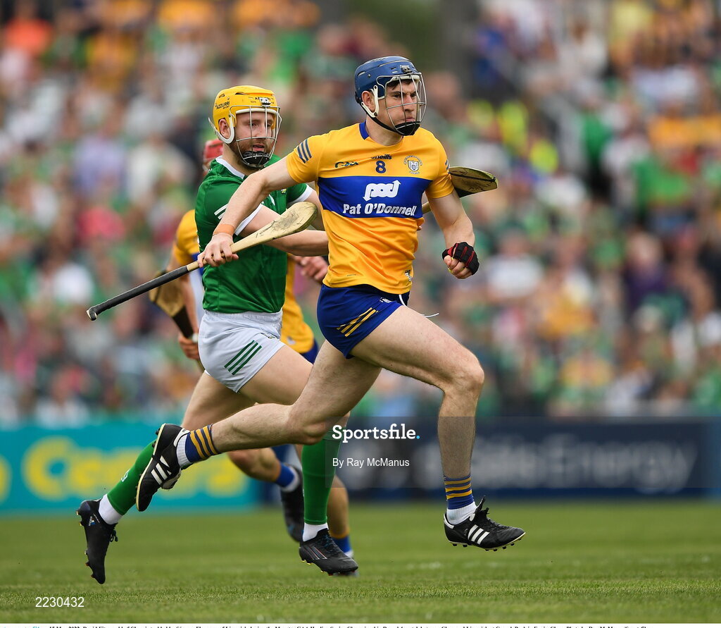 15 May 2022; David Fitzgerald of Clare is tackled by Séamus Flanagan of Limerick during the Munster GAA Hurling Senior Championship Round 4 match between Clare and Limerick at Cusack Park in Ennis, Clare. Photo by Ray McManus/Sportsfile