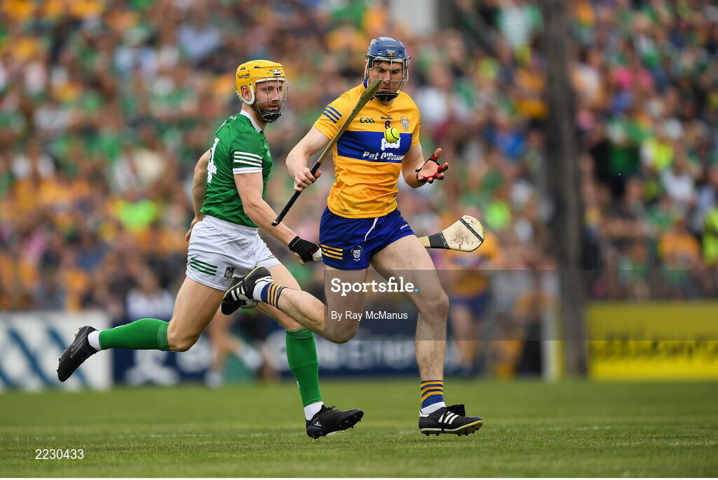 15 May 2022; David Fitzgerald of Clare is tackled by Séamus Flanagan of Limerick during the Munster GAA Hurling Senior Championship Round 4 match between Clare and Limerick at Cusack Park in Ennis, Clare. Photo by Ray McManus/Sportsfile