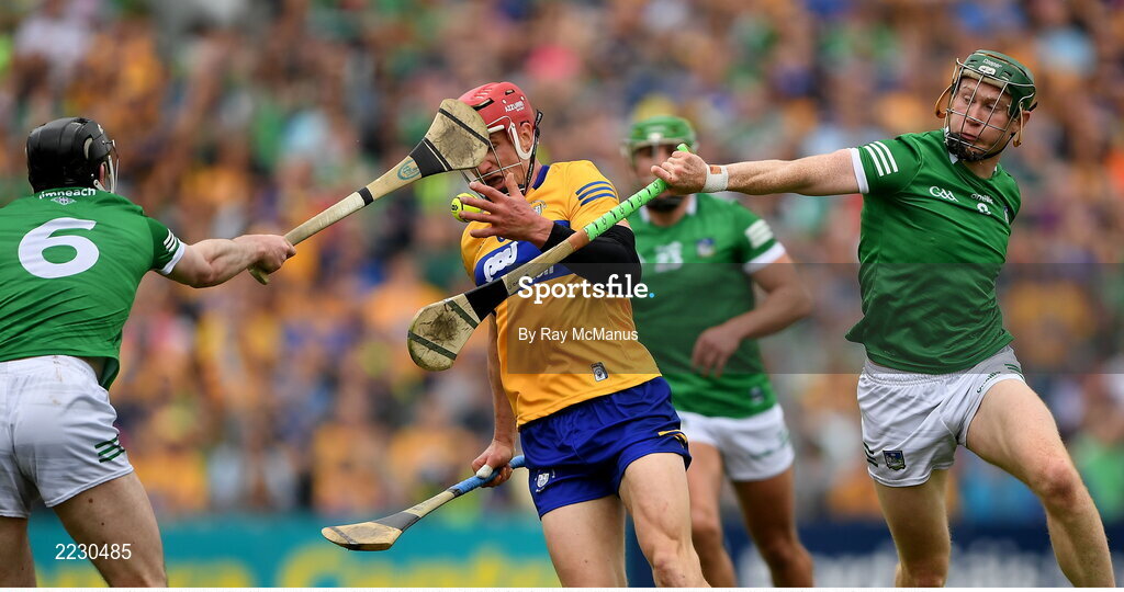 15 May 2022; John Conlon of Clare is tackled by William O'Donogue and Declan Hannon, 6, of Limerick during the Munster GAA Hurling Senior Championship Round 4 match between Clare and Limerick at Cusack Park in Ennis, Clare. Photo by Ray McManus/Sportsfile