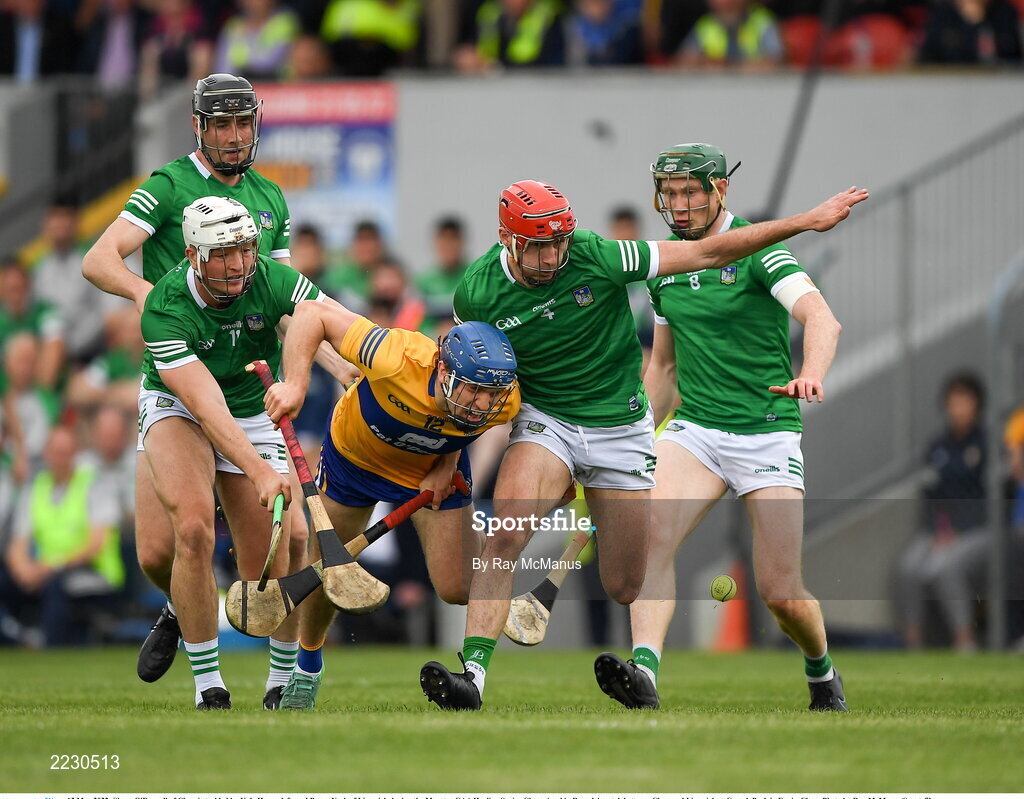 15 May 2022; Shane O'Donnell of Clare is tackled by Kyle Hayes, left, and Barry Nash of Limerick during the Munster GAA Hurling Senior Championship Round 4 match between Clare and Limerick at Cusack Park in Ennis, Clare. Photo by Ray McManus/Sportsfile