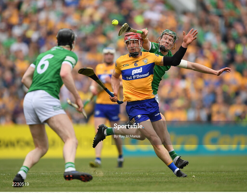 15 May 2022; John Conlon of Clare is tackled by William O'Donogue of Limerick during the Munster GAA Hurling Senior Championship Round 4 match between Clare and Limerick at Cusack Park in Ennis, Clare. Photo by Ray McManus/Sportsfile