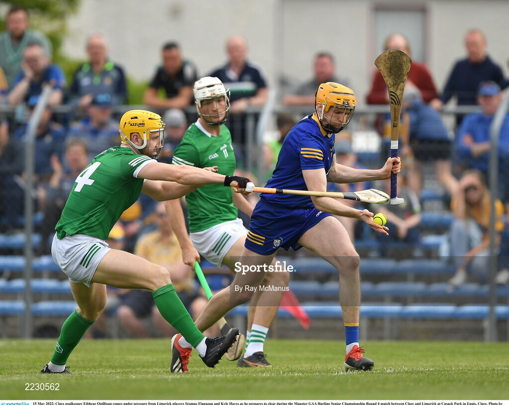 15 May 2022; Clare goalkeeper Eibhear Quilligan comes under pressure from Limerick players Séamus Flanagan and Kyle Hayes as he prepares to clear during the Munster GAA Hurling Senior Championship Round 4 match between Clare and Limerick at Cusack Park in Ennis, Clare. Photo by Ray McManus/Sportsfile