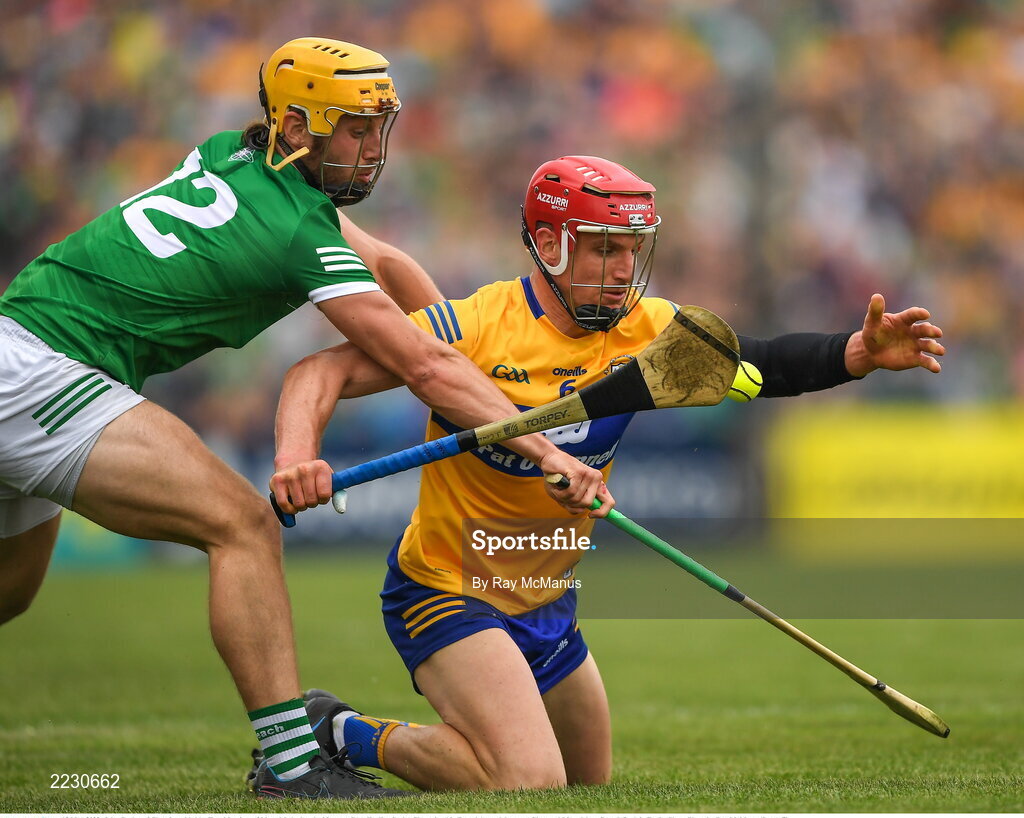 15 May 2022; John Conlon of Clare is tackled by Tom Morrisey of Limerick during the Munster GAA Hurling Senior Championship Round 4 match between Clare and Limerick at Cusack Park in Ennis, Clare. Photo by Ray McManus/Sportsfile