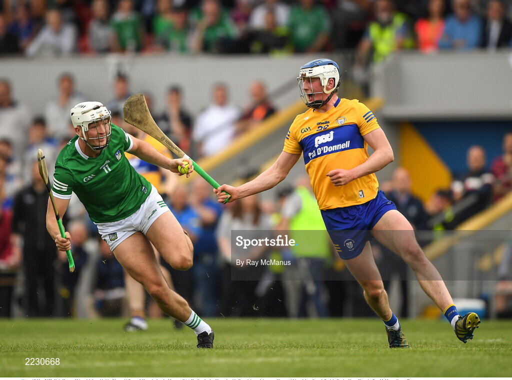 15 May 2022; Kyle Hayes of Limerick is tackled by Diarmuid Ryan of Clare during the Munster GAA Hurling Senior Championship Round 4 match between Clare and Limerick at Cusack Park in Ennis, Clare. Photo by Ray McManus/Sportsfile
