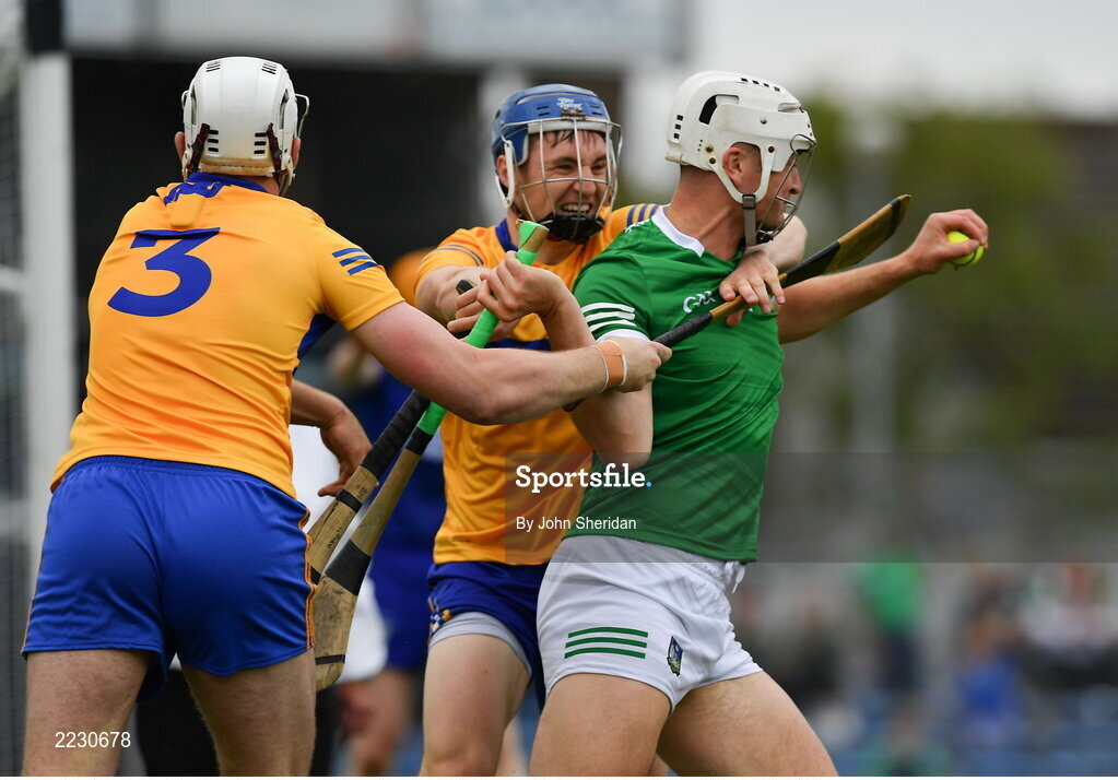 15 May 2022; Kyle Hayes of Limerick is tackled by Rory Hayes and Conor Cleary of Clare during the Munster GAA Hurling Senior Championship Round 4 match between Clare and Limerick at Cusack Park in Ennis, Clare. Photo by John Sheridan/Sportsfile