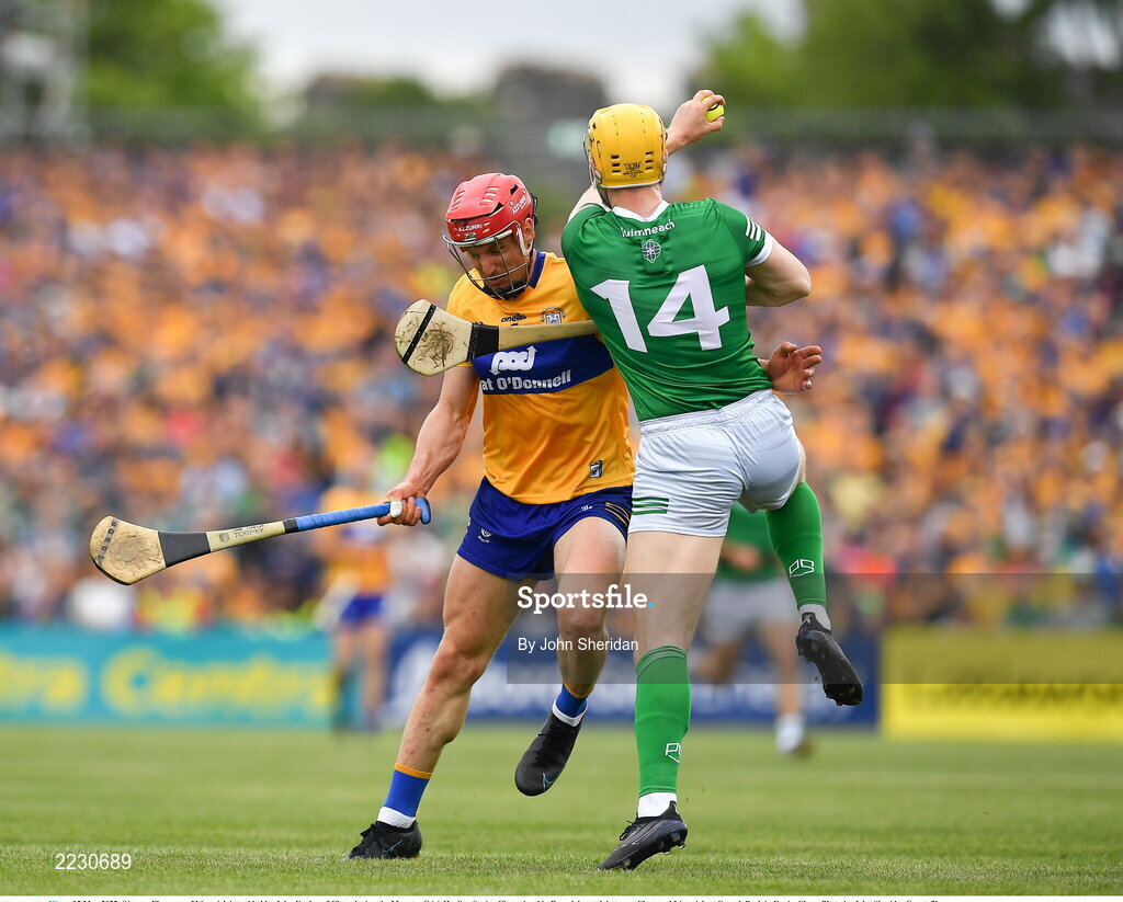 15 May 2022; Séamus Flanagan of Limerick is tackled by John Conlon of Clare during the Munster GAA Hurling Senior Championship Round 4 match between Clare and Limerick at Cusack Park in Ennis, Clare. Photo by John Sheridan/Sportsfile