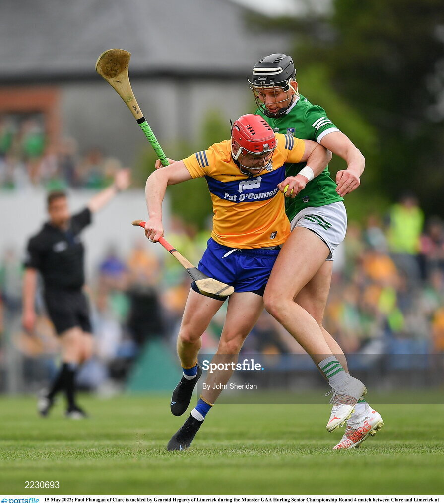 15 May 2022; Paul Flanagan of Clare is tackled by Gearóid Hegarty of Limerick during the Munster GAA Hurling Senior Championship Round 4 match between Clare and Limerick at Cusack Park in Ennis, Clare. Photo by John Sheridan/Sportsfile