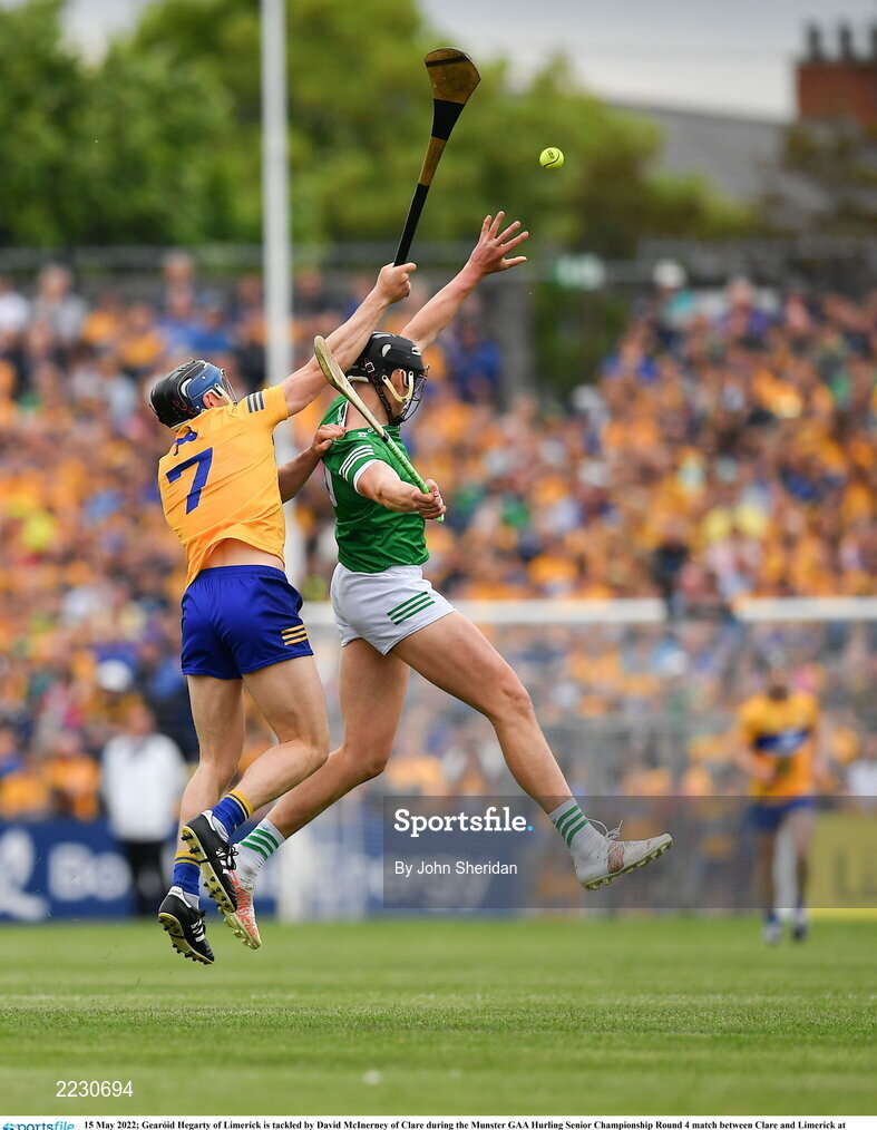 15 May 2022; Gearóid Hegarty of Limerick is tackled by David McInerney of Clare during the Munster GAA Hurling Senior Championship Round 4 match between Clare and Limerick at Cusack Park in Ennis, Clare. Photo by Ray McManus/Sportsfile