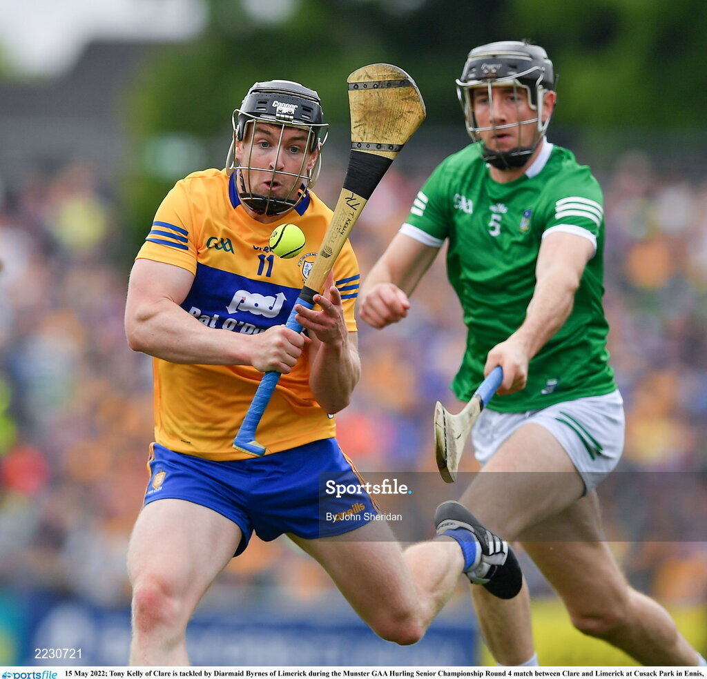 15 May 2022; Tony Kelly of Clare is tackled by Diarmaid Byrnes of Limerick during the Munster GAA Hurling Senior Championship Round 4 match between Clare and Limerick at Cusack Park in Ennis, Clare. Photo by John Sheridan/Sportsfile