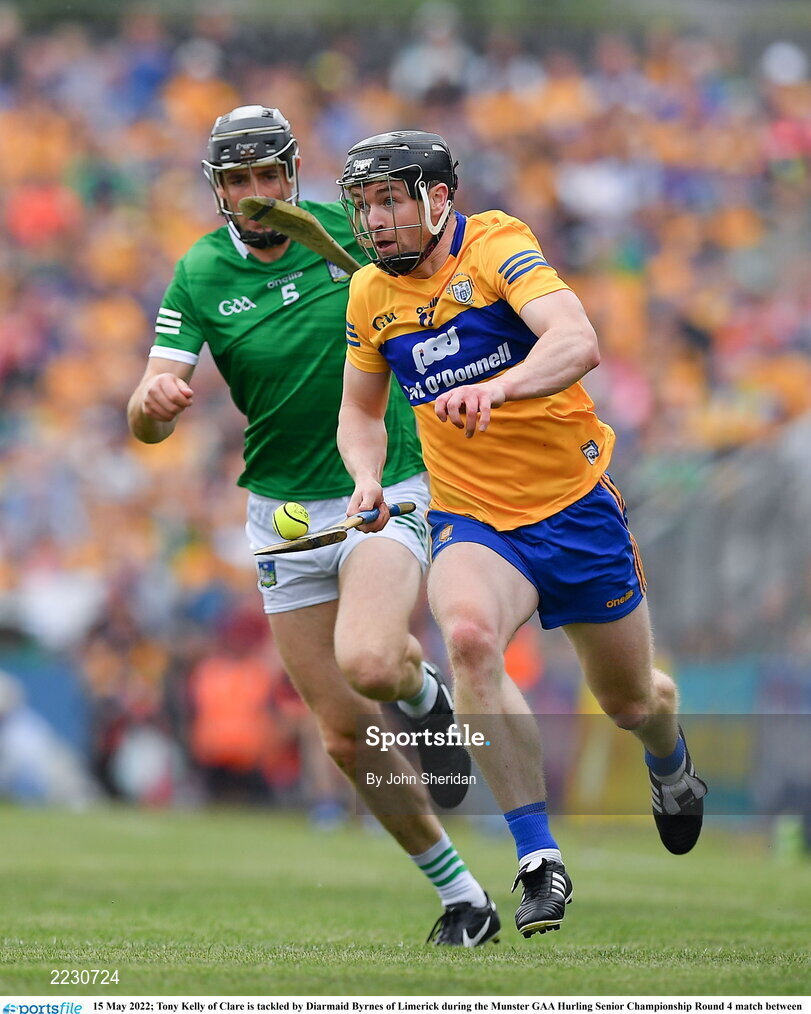 15 May 2022; Tony Kelly of Clare is tackled by Diarmaid Byrnes of Limerick during the Munster GAA Hurling Senior Championship Round 4 match between Clare and Limerick at Cusack Park in Ennis, Clare. Photo by John Sheridan/Sportsfile