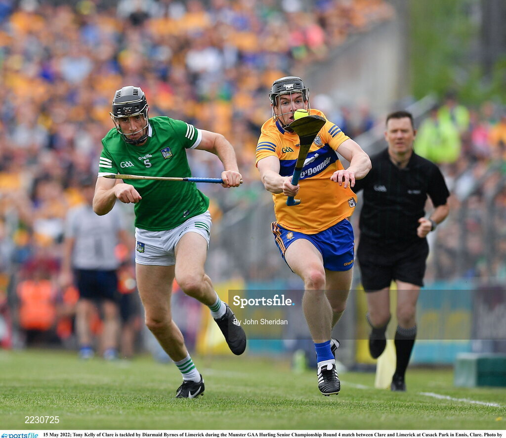15 May 2022; Tony Kelly of Clare is tackled by Diarmaid Byrnes of Limerick during the Munster GAA Hurling Senior Championship Round 4 match between Clare and Limerick at Cusack Park in Ennis, Clare. Photo by John Sheridan/Sportsfile