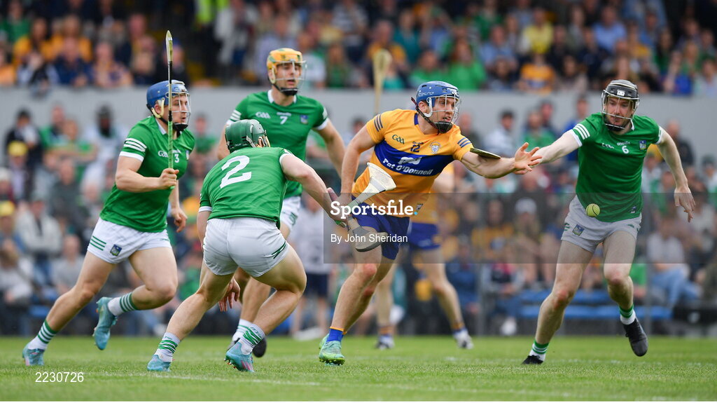 15 May 2022; Shane O'Donnell of Clare is tackled by Declan Hannon and Sean Finn of Limerick during the Munster GAA Hurling Senior Championship Round 4 match between Clare and Limerick at Cusack Park in Ennis, Clare. Photo by John Sheridan/Sportsfile