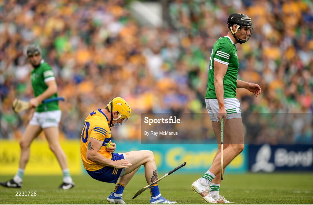 15 May 2022; Aaron Fitzgerald of Clare falls after a clash with Gearóid Hegarty of Limerick during the Munster GAA Hurling Senior Championship Round 4 match between Clare and Limerick at Cusack Park in Ennis, Clare. Photo by Ray McManus/Sportsfile