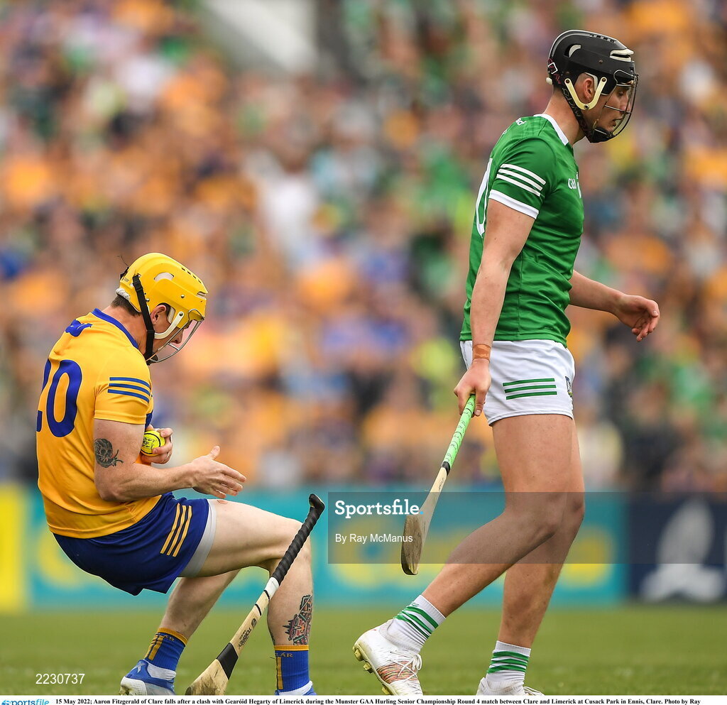 15 May 2022; Aaron Fitzgerald of Clare falls after a clash with Gearóid Hegarty of Limerick during the Munster GAA Hurling Senior Championship Round 4 match between Clare and Limerick at Cusack Park in Ennis, Clare. Photo by Ray McManus/Sportsfile