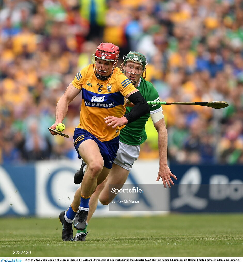 15 May 2022; John Conlon of Clare is tackled by William O'Donogue of Limerick during the Munster GAA Hurling Senior Championship Round 4 match between Clare and Limerick at Cusack Park in Ennis, Clare. Photo by Ray McManus/Sportsfile