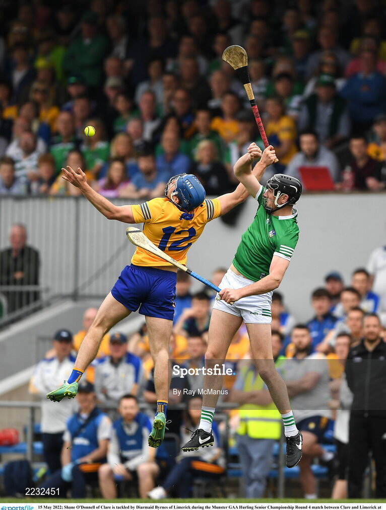 15 May 2022; Shane O'Donnell of Clare is tackled by Diarmaid Byrnes of Limerick during the Munster GAA Hurling Senior Championship Round 4 match between Clare and Limerick at Cusack Park in Ennis, Clare. Photo by Ray McManus/Sportsfile