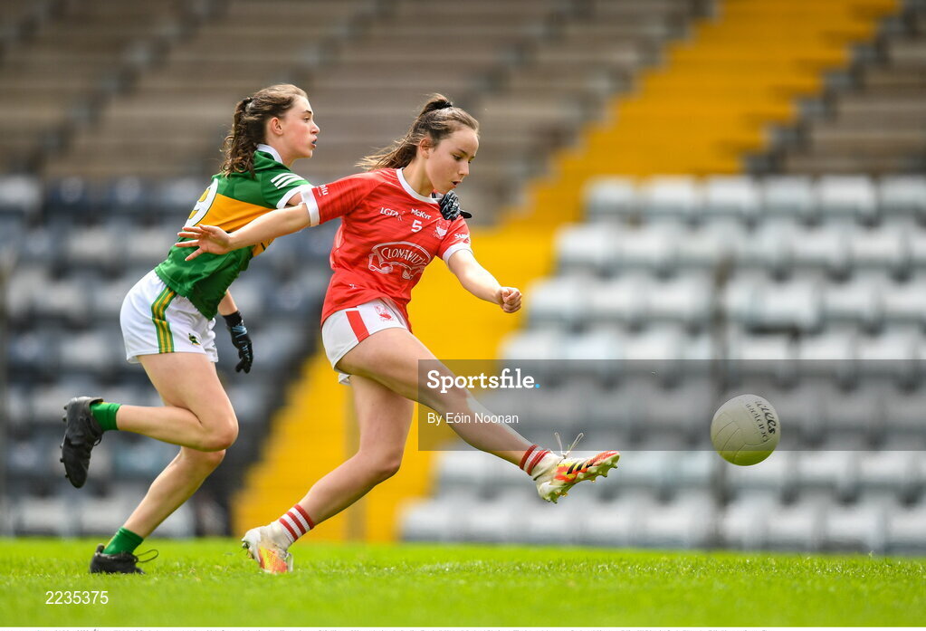 21 May 2022; Éimear Walsh of Cork shoots to score her side's first goal despite the efforts of Anna O'Sullivan of Kerry during the Ladies Football U14 All-Ireland Platinum Final match between Cork and Kerry at Páirc Uí Rinn in Cork. Photo by Eóin Noonan/Sportsfile
