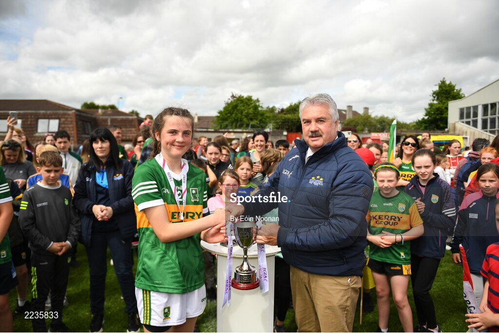 21 May 2022; Kerry captain Jamie Lee O'Connor is presented with the cup by Robbie Smyth, Munster LGFA President, after the Ladies Football U14 All-Ireland Platinum Final match between Cork and Kerry at Páirc Uí Rinn in Cork. Photo by Eóin Noonan/Sportsfile