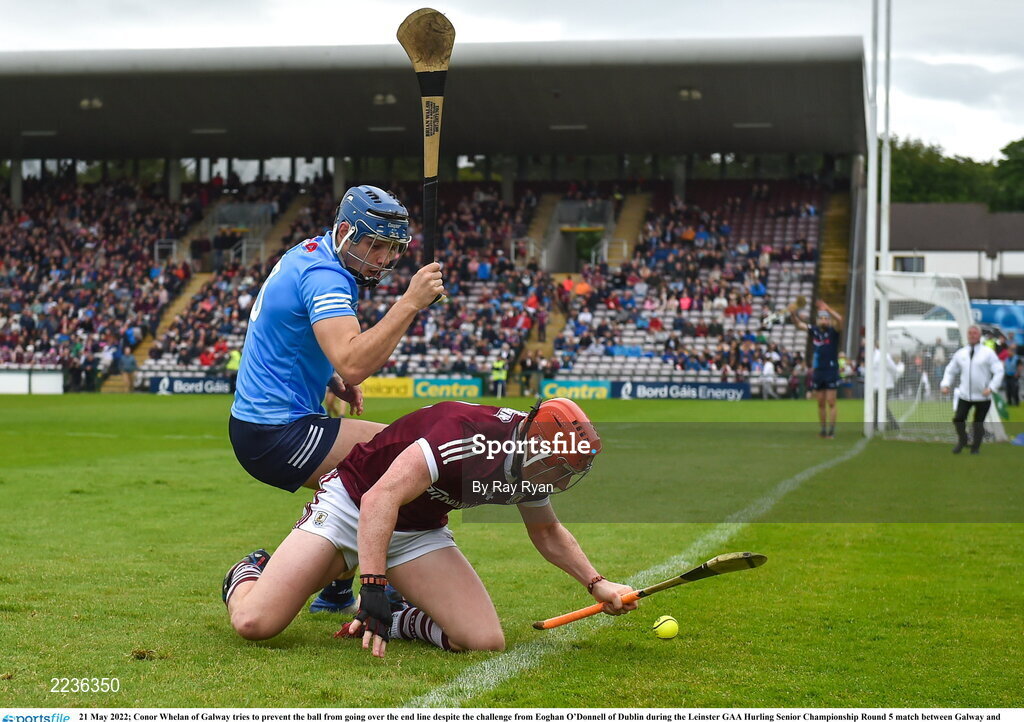 21 May 2022; Conor Whelan of Galway tries to prevent the ball from going over the end line despite the challenge from Eoghan O’Donnell of Dublin during the Leinster GAA Hurling Senior Championship Round 5 match between Galway and Dublin at Pearse Stadium in Galway. Photo by Ray Ryan/Sportsfile
