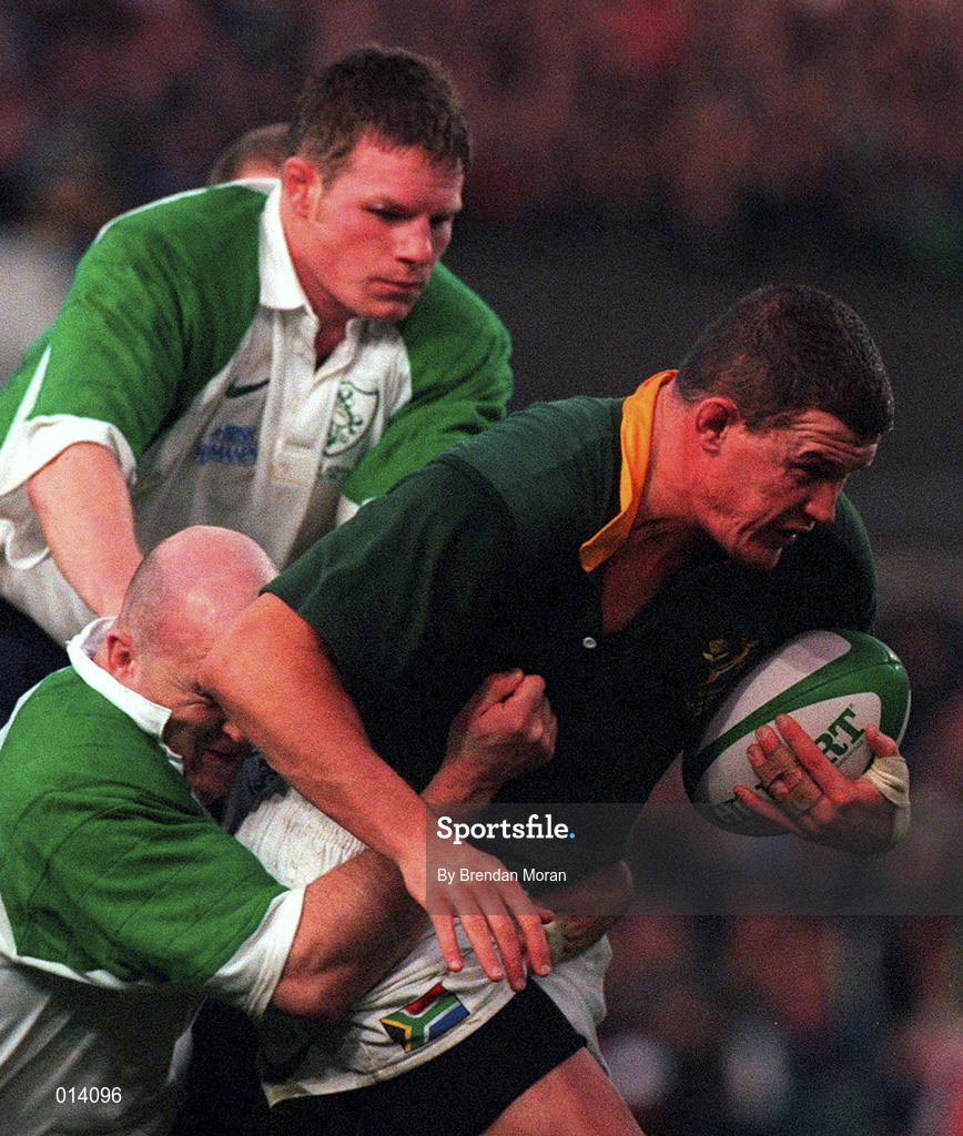 28 November 1998; Adrian Garvey of South Africa is tackled by Keith Wood and Malcolm O'Kelly of Ireland during a International Friendly Match between Ireland and South Africa at Landsdowne Road in Dublin. Photo by Brendan Moran/Sportsfile