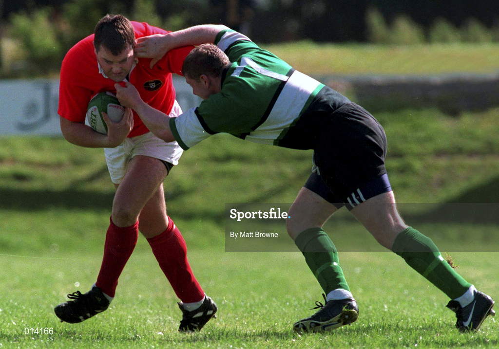 12 September 1998: Anthony Foley of Munster is tackled by Shane McEntee of Connacht during the Guinness Interprovincial Rugby Championship match between Munster and Connacht at Dooradoyle in Limerick. Photo by Matt Browne/Sportsfile