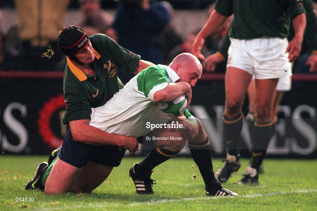 28 November 1998; Keith Wood of Ireland goes over to score Ireland's first try despite the efforts of Johan Erasmus of South Africa during a International Friendly Match between Ireland and South Africa at Landsdowne Road in Dublin. Photo by Brendan Moran/Sportsfile