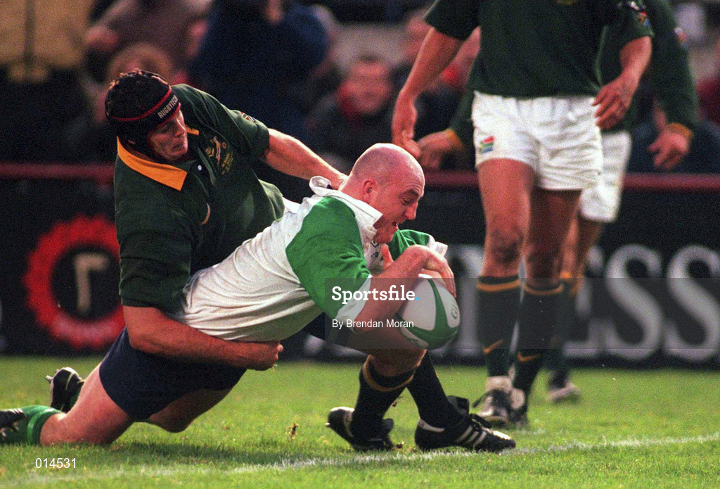 28 November 1998; Keith Wood of Ireland goes over to score Ireland's first try despite the efforts of Johan Erasmus of South Africa during a International Friendly Match between Ireland and South Africa at Landsdowne Road in Dublin. Photo by Brendan Moran/Sportsfile