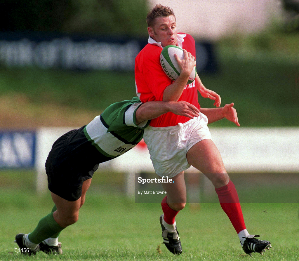 12 September 1998: Killian Keane of Munster is tackled by Simon Allnutt of Connacht during the Guinness Interprovincial Rugby Championship match between Munster and Connacht at Dooradoyle in Limerick. Photo by Matt Browne/Sportsfile