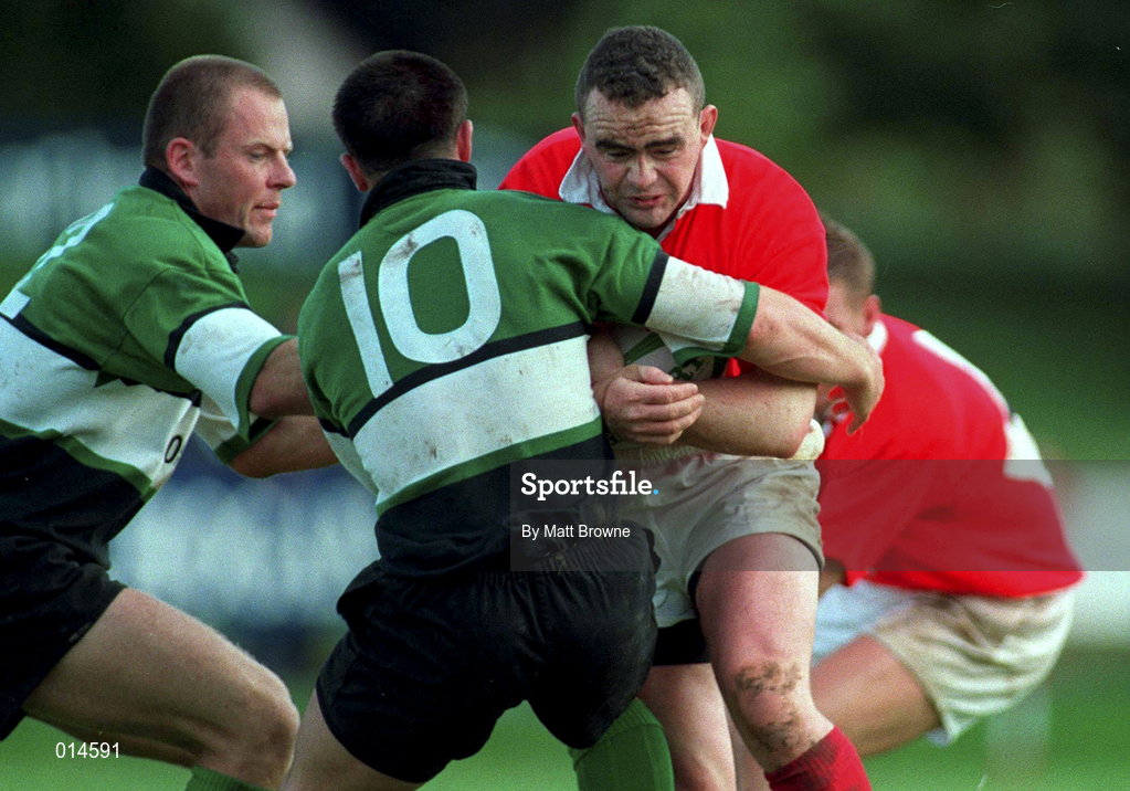 12 September 1998: Michael Lynch of Munster is tackled by Simon Allnutt, 10, and Mervyn Murphy of Connacht  during the Guinness Interprovincial Rugby Championship match between Munster and Connacht at Dooradoyle in Limerick. Photo by Matt Browne/Sportsfile
