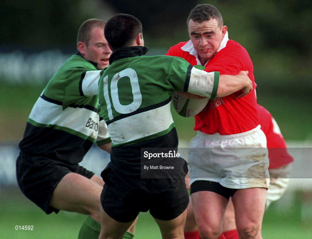 12 September 1998: Michael Lynch of Munster is tackled by Simon Allnutt, 10, and Mervyn Murphy of Connacht  during the Guinness Interprovincial Rugby Championship match between Munster and Connacht at Dooradoyle in Limerick. Photo by Matt Browne/Sportsfile