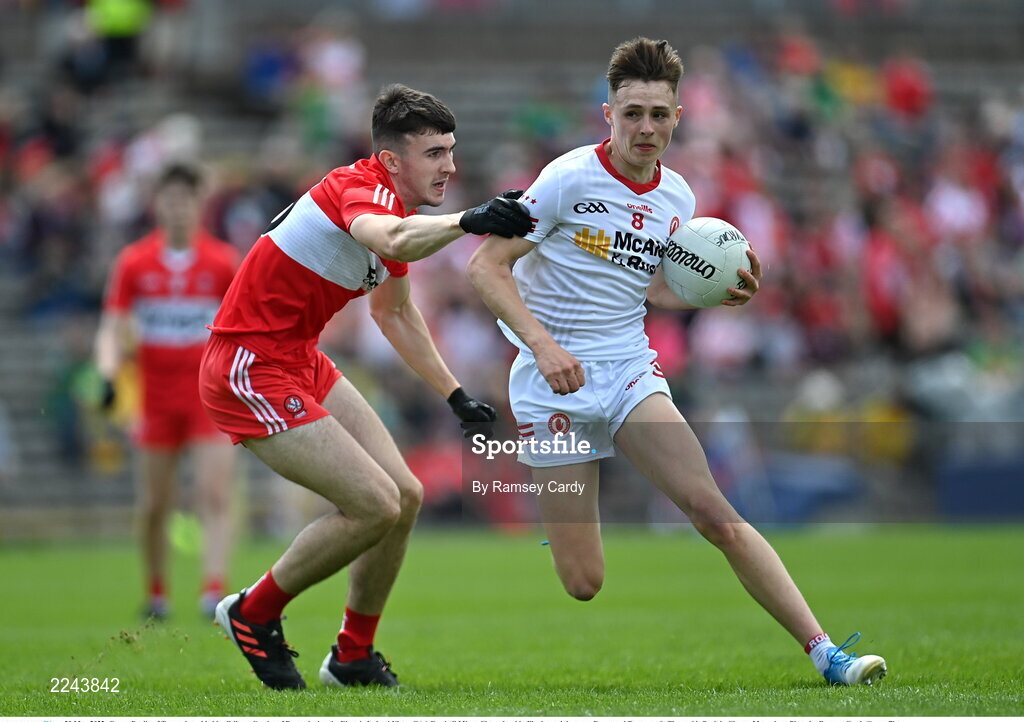29 May 2022; Conan Devlin of Tyrone is tackled by Odhran Crozier of Derry during the Electric Ireland Ulster GAA Football Minor Championship Final match between Derry and Tyrone at St Tiernach's Park in Clones, Monaghan. Photo by Ramsey Cardy/Sportsfile