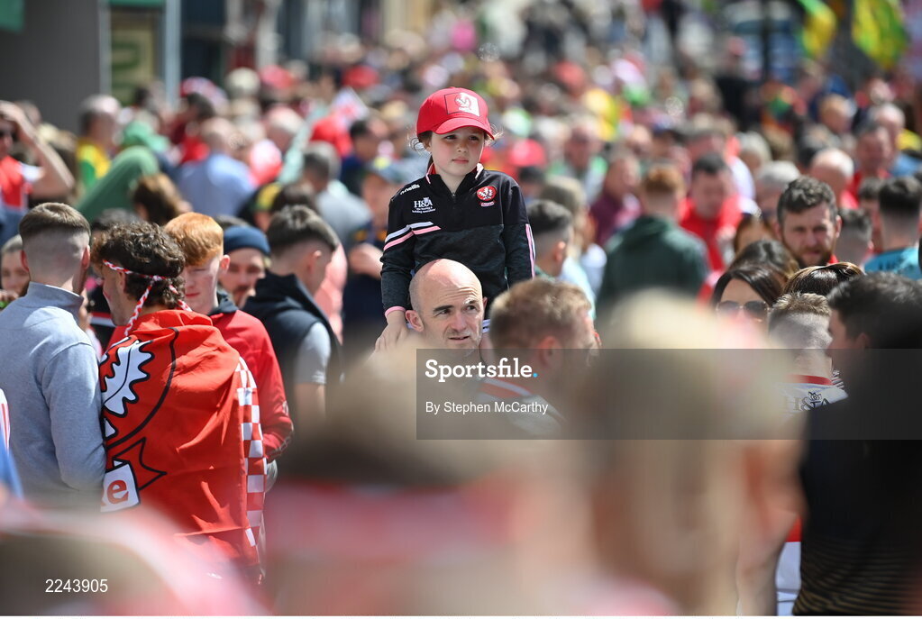 29 May 2022; Derry Supporters Aoife, age 8, and her father Eamon Tennyson, from Castledawson, make their way to the Ulster GAA Football Senior Championship Final between Derry and Donegal at St Tiernach's Park in Clones, Monaghan. Photo by Stephen McCarthy/Sportsfile