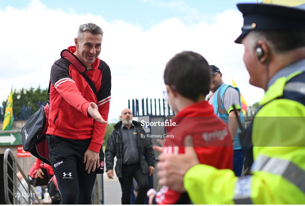 29 May 2022; Derry manager Rory Gallagher greets 7 year old Derry supporter Oisin McEldowney, from Slaughtneil, before the Ulster GAA Football Senior Championship Final between Derry and Donegal at St Tiernach's Park in Clones, Monaghan. Photo by Ramsey Cardy/Sportsfile