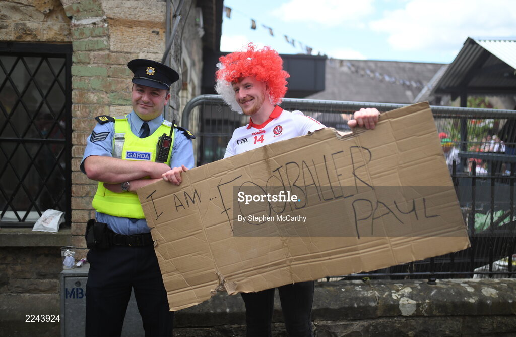29 May 2022; A Derry supporter poses for a photograph with a member of An Garda Síochána before the Ulster GAA Football Senior Championship Final between Derry and Donegal at St Tiernach's Park in Clones, Monaghan. Photo by Stephen McCarthy/Sportsfile