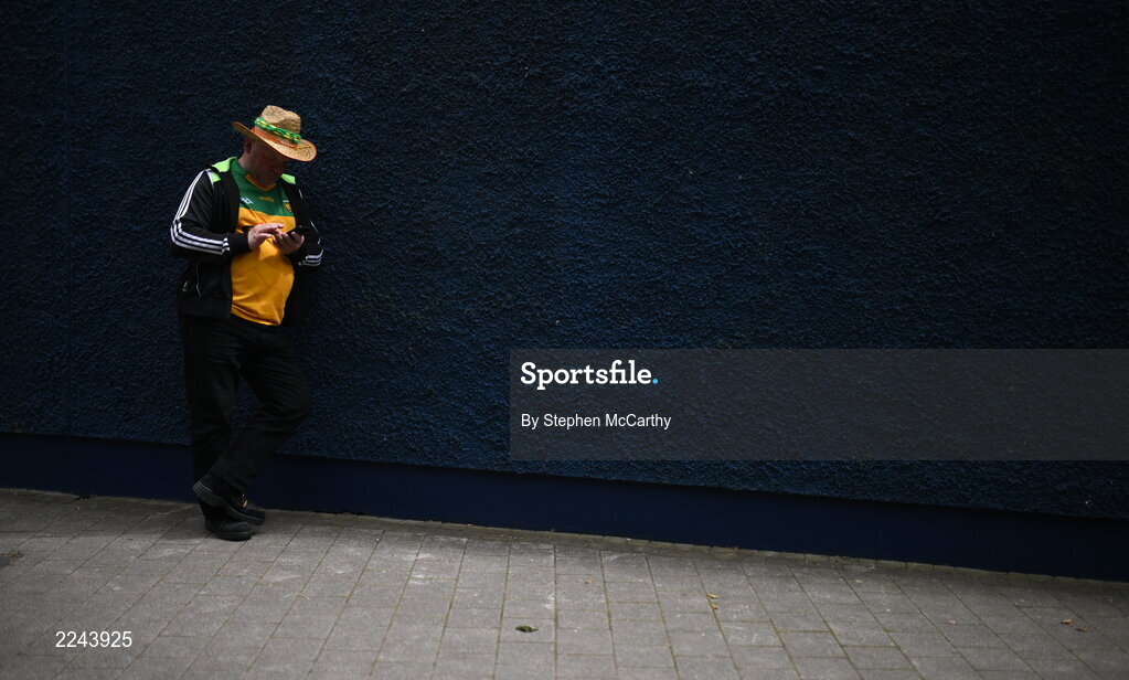 29 May 2022; A Donegal supporter checkes his phone before the Ulster GAA Football Senior Championship Final between Derry and Donegal at St Tiernach's Park in Clones, Monaghan. Photo by Stephen McCarthy/Sportsfile