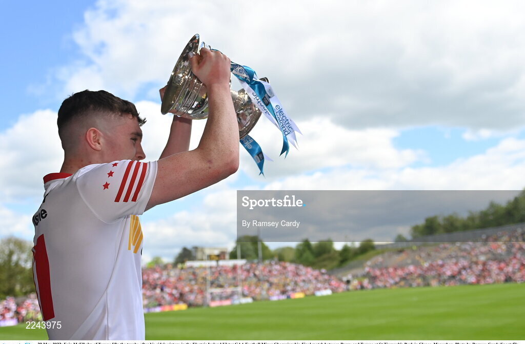 29 May 2022; Eoin McElholm of Tyrone lifts the trophy after his side's victory in the Electric Ireland Ulster GAA Football Minor Championship Final match between Derry and Tyrone at St Tiernach's Park in Clones, Monaghan. Photo by Ramsey Cardy/Sportsfile
