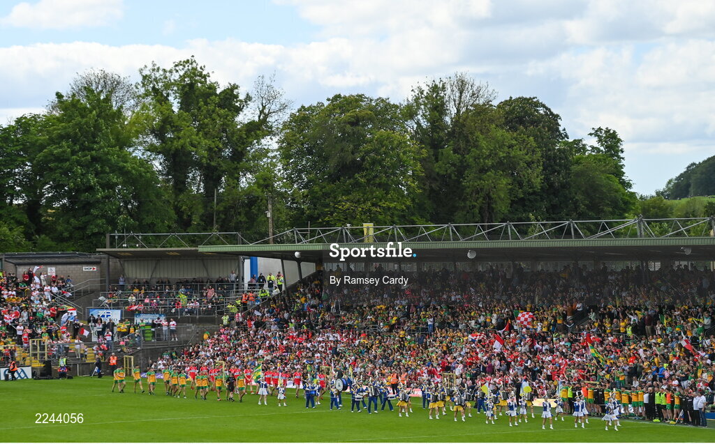 29 May 2022; Both teams parade behind the Mayobridge Band, from Co Down, before the Ulster GAA Football Senior Championship Final between Derry and Donegal at St Tiernach's Park in Clones, Monaghan. Photo by Ramsey Cardy/Sportsfile
