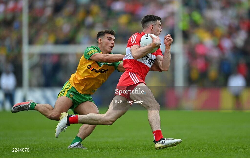 29 May 2022; Shea Downey of Derry and Odhran McFadden Ferry of Donegal during the Ulster GAA Football Senior Championship Final between Derry and Donegal at St Tiernach's Park in Clones, Monaghan. Photo by Ramsey Cardy/Sportsfile