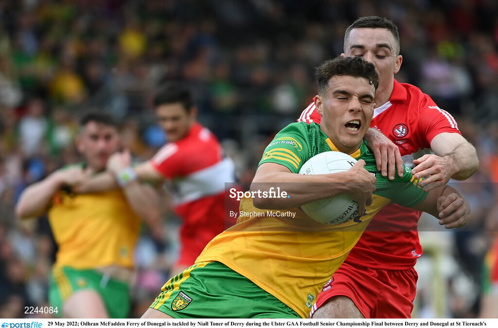 29 May 2022; Odhran McFadden Ferry of Donegal is tackled by Niall Toner of Derry during the Ulster GAA Football Senior Championship Final between Derry and Donegal at St Tiernach's Park in Clones, Monaghan. Photo by Stephen McCarthy/Sportsfile