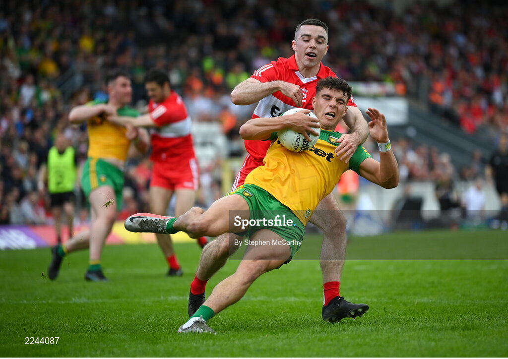 29 May 2022; Odhran McFadden Ferry of Donegal is tackled by Niall Toner of Derry during the Ulster GAA Football Senior Championship Final between Derry and Donegal at St Tiernach's Park in Clones, Monaghan. Photo by Stephen McCarthy/Sportsfile