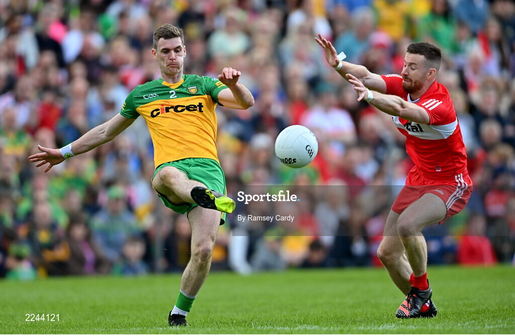 29 May 2022; Caolan Ward of Donegal and Niall Loughlin of Derry during the Ulster GAA Football Senior Championship Final between Derry and Donegal at St Tiernach's Park in Clones, Monaghan. Photo by Ramsey Cardy/Sportsfile