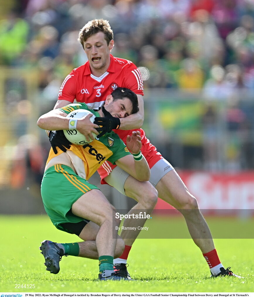 29 May 2022; Ryan McHugh of Donegal is tackled by Brendan Rogers of Derry during the Ulster GAA Football Senior Championship Final between Derry and Donegal at St Tiernach's Park in Clones, Monaghan. Photo by Ramsey Cardy/Sportsfile