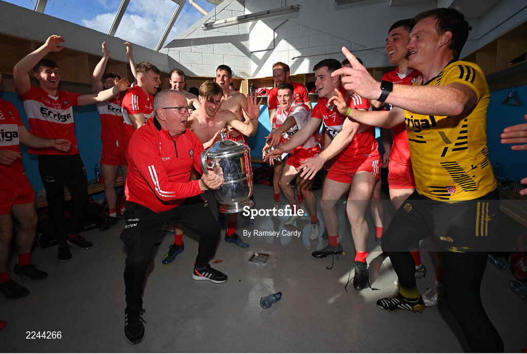 29 May 2022; Derry kitman Colin McGuigan and Derry players celebrate with the trophy after the Ulster GAA Football Senior Championship Final between Derry and Donegal at St Tiernach's Park in Clones, Monaghan. Photo by Ramsey Cardy/Sportsfile