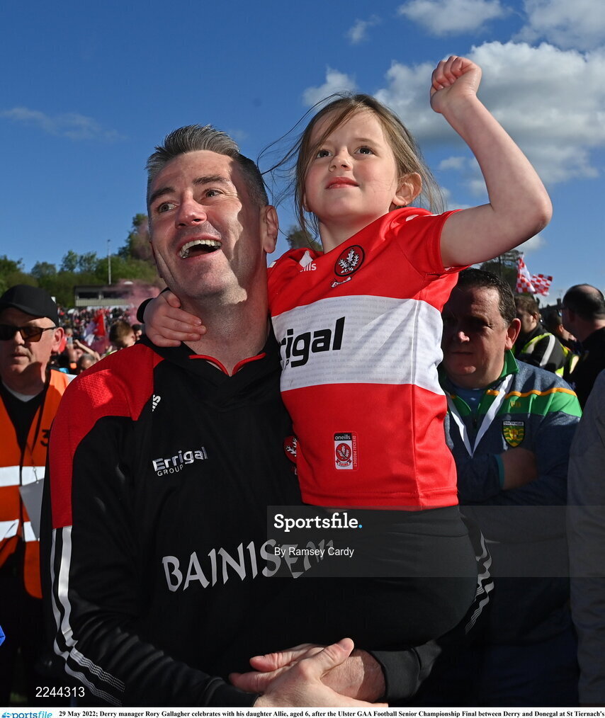 29 May 2022; Derry manager Rory Gallagher celebrates with his daughter Allie, aged 6, after the Ulster GAA Football Senior Championship Final between Derry and Donegal at St Tiernach's Park in Clones, Monaghan. Photo by Ramsey Cardy/Sportsfile
