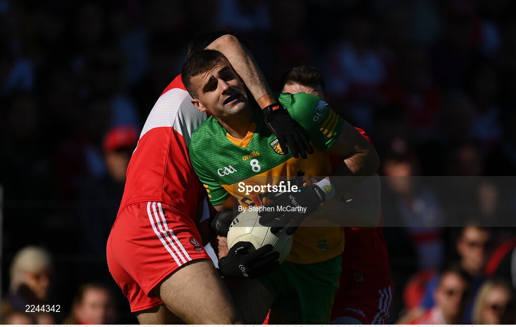 29 May 2022; Caolan McGonagle of Donegal in action against Christopher McKaigue, left, and Gareth McKinless of Derry during the Ulster GAA Football Senior Championship Final between Derry and Donegal at St Tiernach's Park in Clones, Monaghan. Photo by Stephen McCarthy/Sportsfile