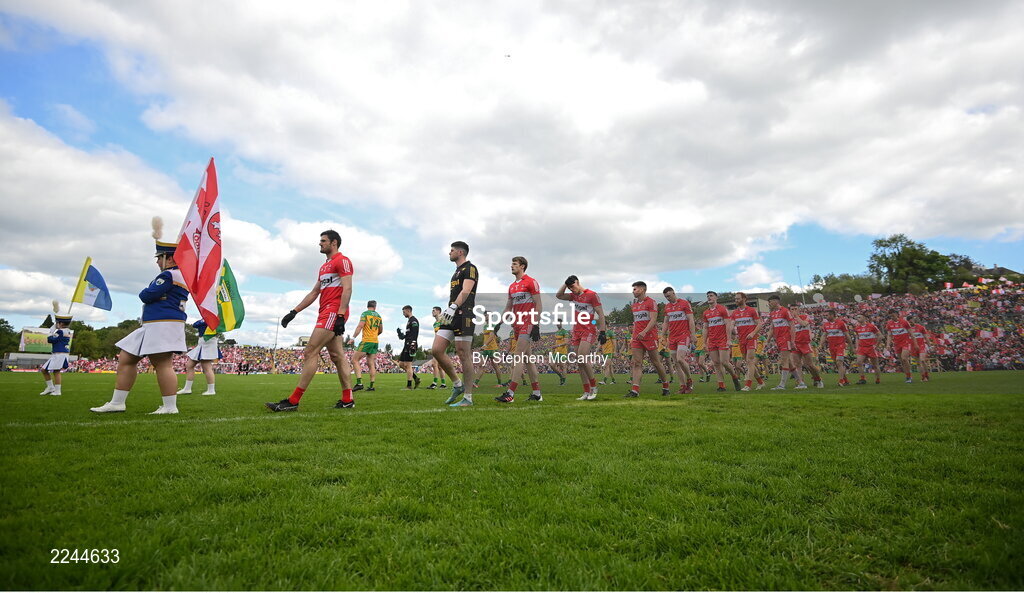 29 May 2022; Members of the Mayobridge Band, from Co Down, lead Derry players in the pre-match parade before the Ulster GAA Football Senior Championship Final between Derry and Donegal at St Tiernach's Park in Clones, Monaghan. Photo by Stephen McCarthy/Sportsfile