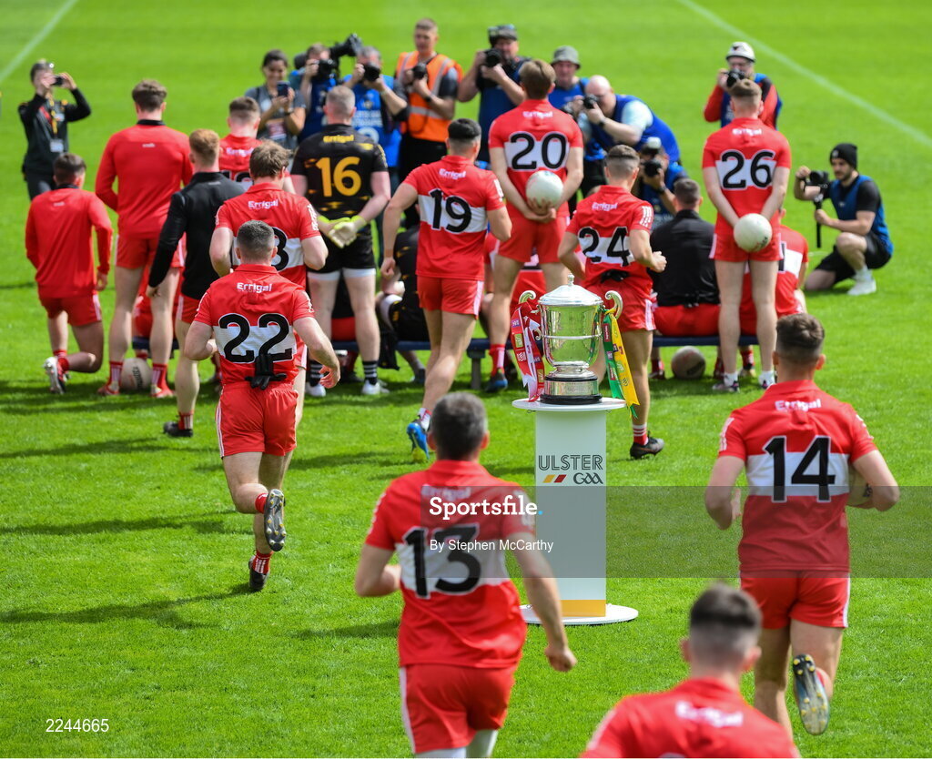 29 May 2022; Derry players run past the Anglo Celt Cup before having the team photograph taken prior to the Ulster GAA Football Senior Championship Final between Derry and Donegal at St Tiernach's Park in Clones, Monaghan. Photo by Stephen McCarthy/Sportsfile