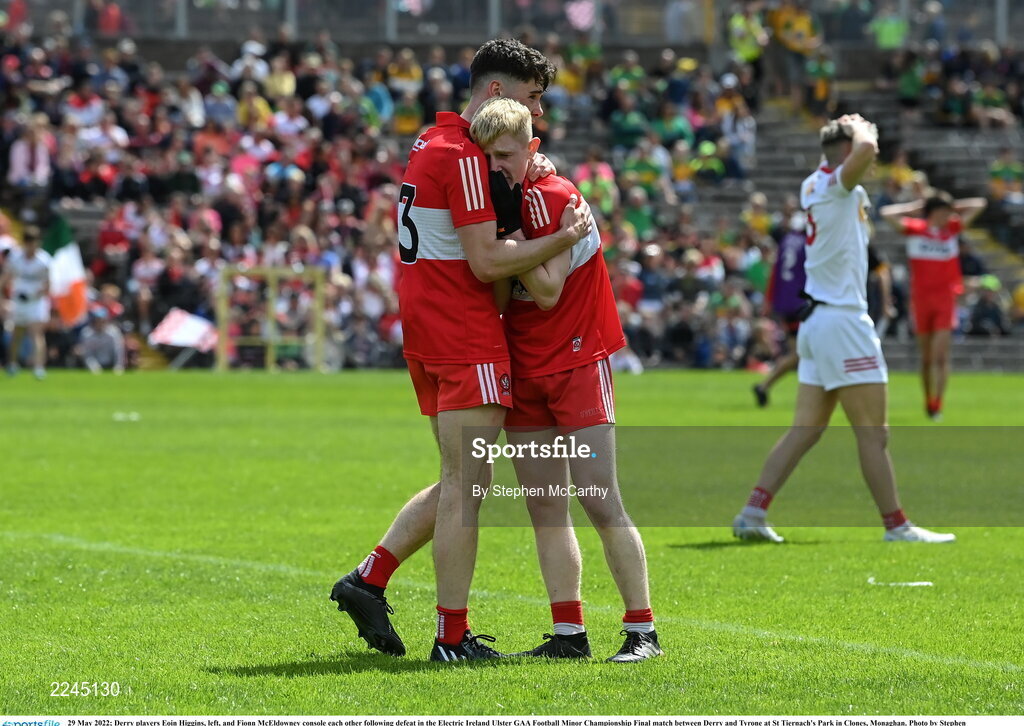 29 May 2022; Derry players Eoin Higgins, left, and Fionn McEldowney console each other following defeat in the Electric Ireland Ulster GAA Football Minor Championship Final match between Derry and Tyrone at St Tiernach's Park in Clones, Monaghan. Photo by Stephen McCarthy/Sportsfile