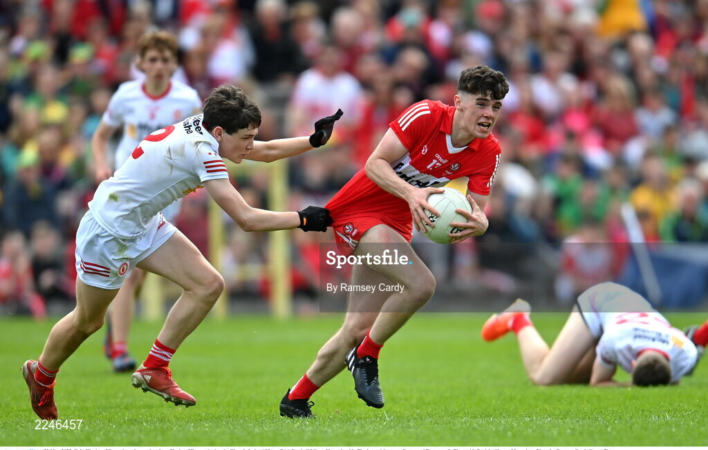 29 May 2022; Eoin Higgins of Derry in action against Joey Clarke of Tyrone during the Electric Ireland Ulster GAA Football Minor Championship Final match between Derry and Tyrone at St Tiernach's Park in Clones, Monaghan. Photo by Ramsey Cardy/Sportsfile